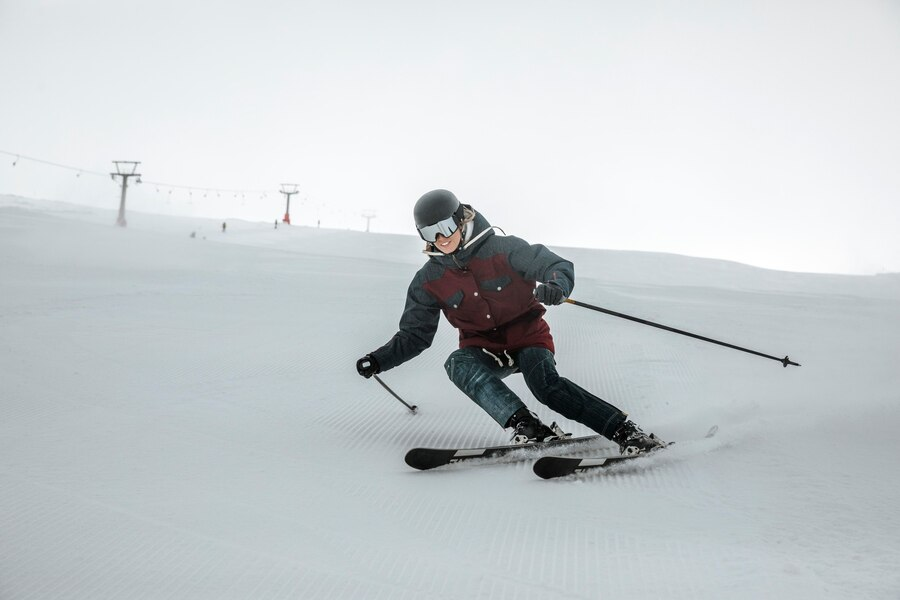 Someone skiing on snow with complete gear